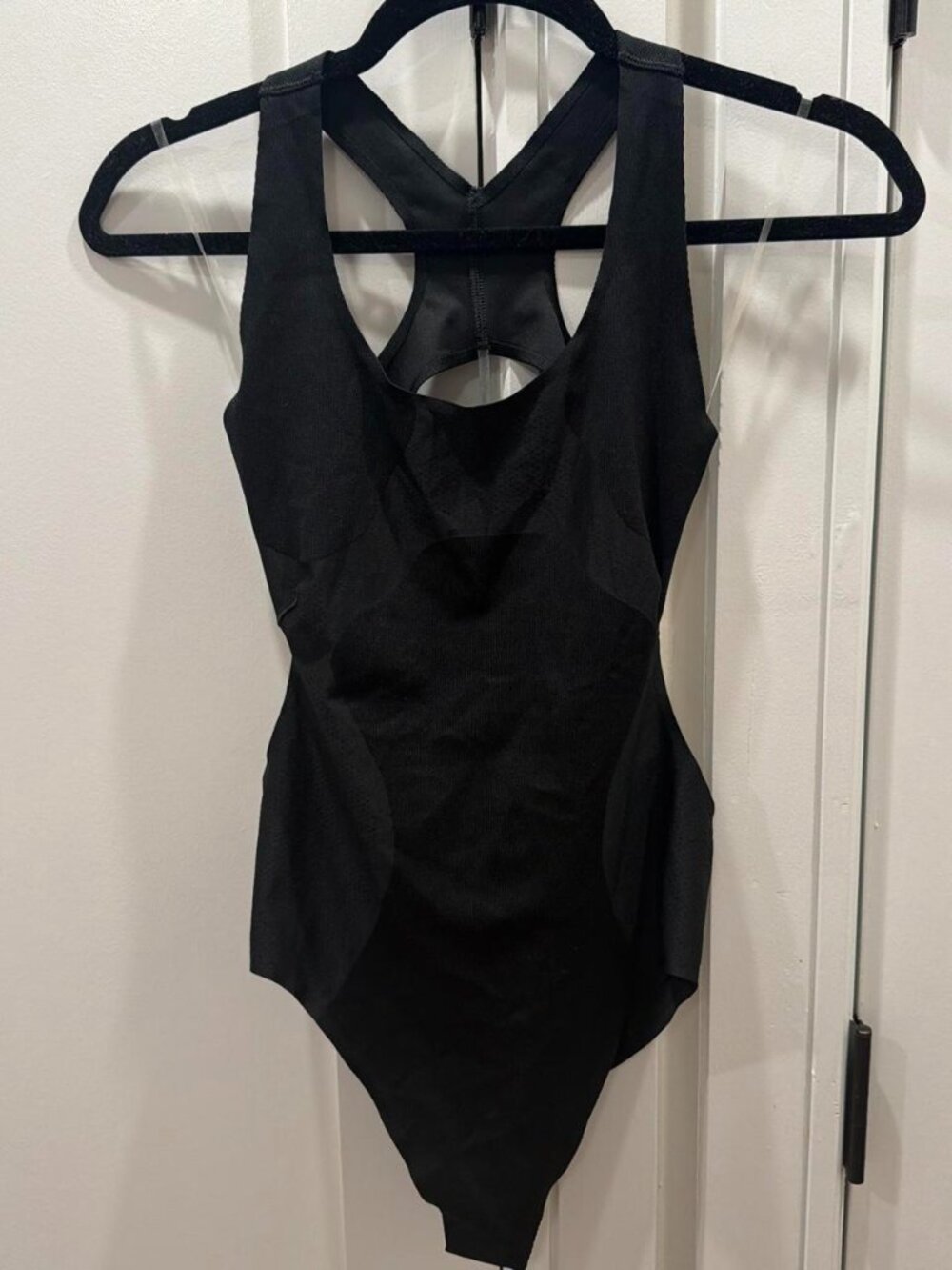 Nike black running bodysuit with cutout detail
